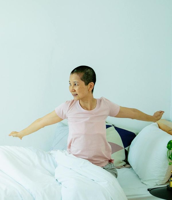 Person starting their morning with gentle movement exercises